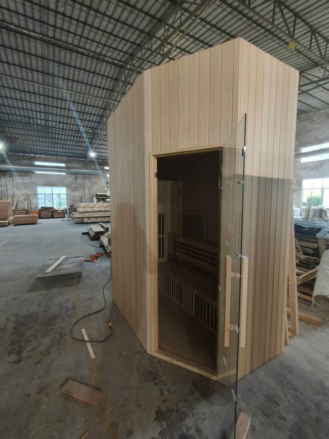 A sauna room frame squared up on the workshop floor