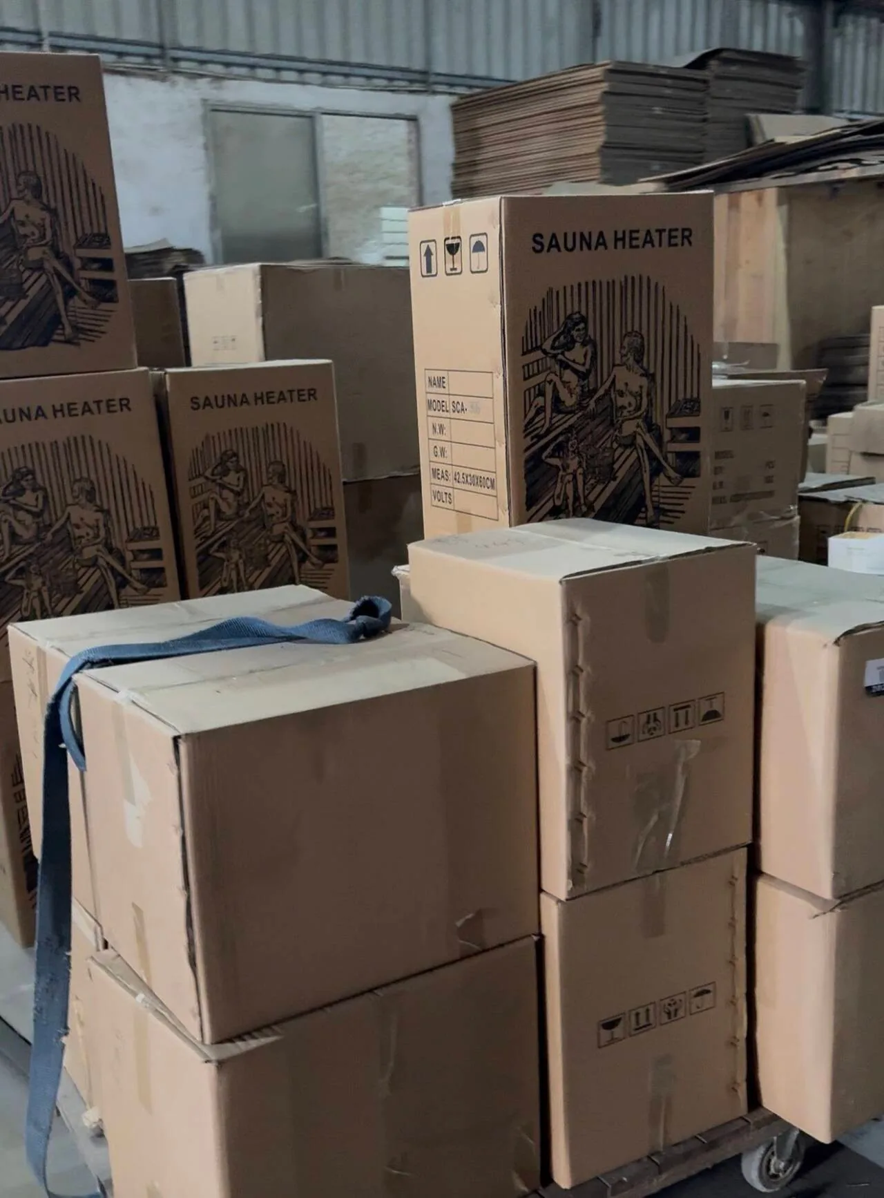 Cartons marked SAUNA HEATER staged for dispatch