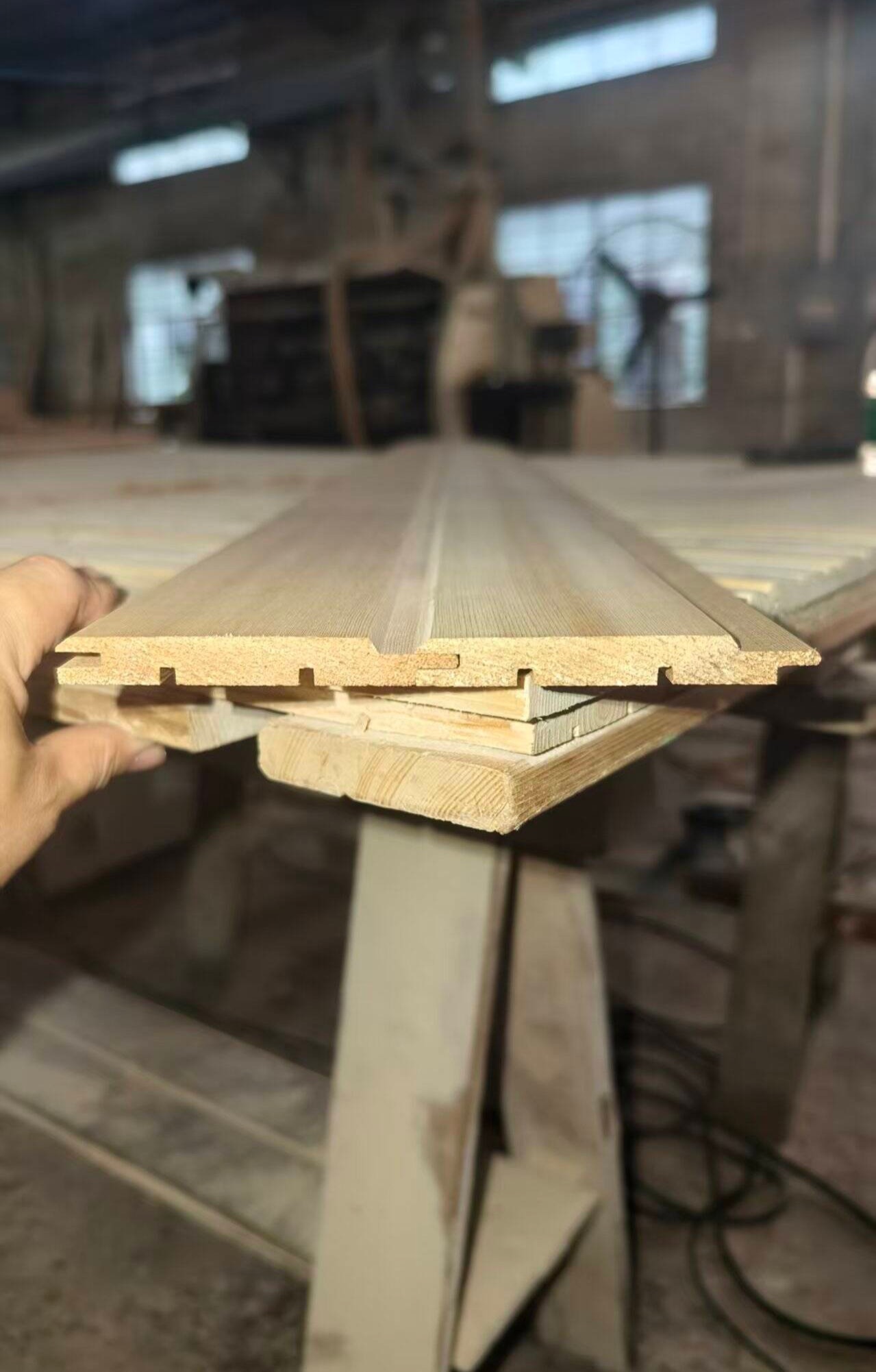 Sawn boards stacked in the material store.