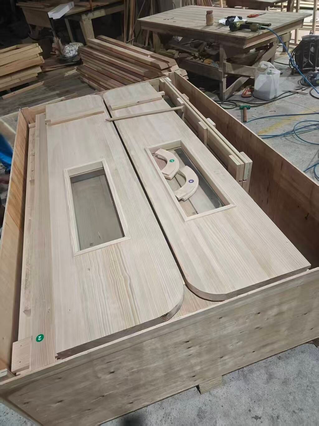 Cladding panels packed into a crate for shipment.